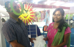 Selfie Contest Winner Receiving T shirt From Dhivya, part of Organizing Team