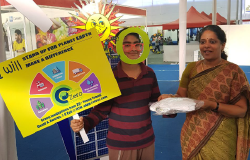 Selfie Contest Winner Receiving T-shirt from Dr. Indumathi M. Nambi