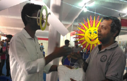 Selfie Contest Winner Receiving T-shirt from Mr. Narasimhan Santhanam, EAI